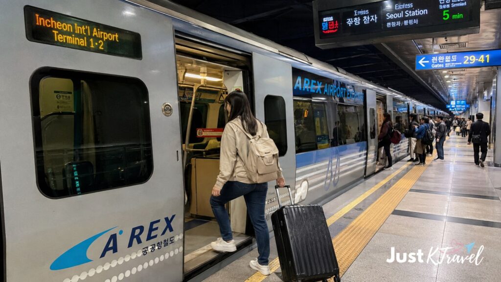 Tourist boarding AREX Airport Railroad train from Incheon Airport to Seoul