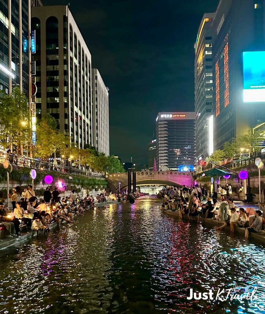 Cheonggyecheon Stream at night in Seoul with city lights