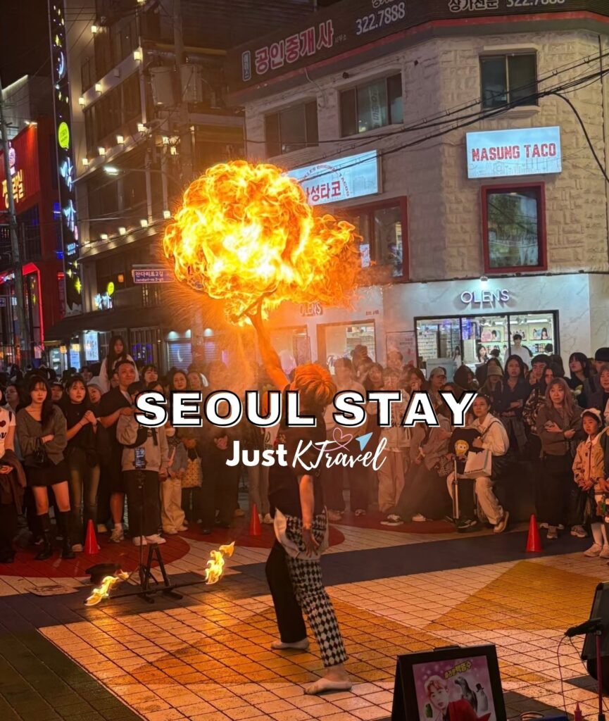 Street busking performance in Hongdae Seoul at night with crowd and city lights