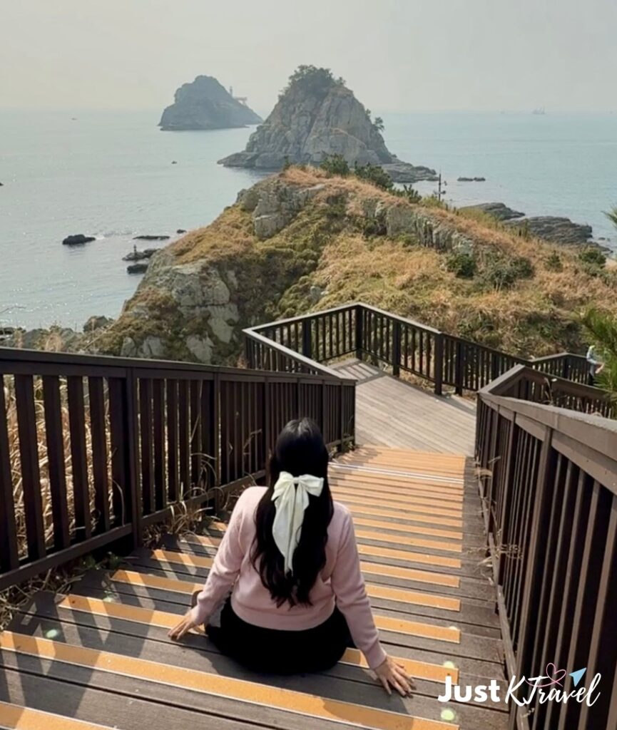 Solo traveler at Oryukdo Skywalk Busan South Korea coastal view