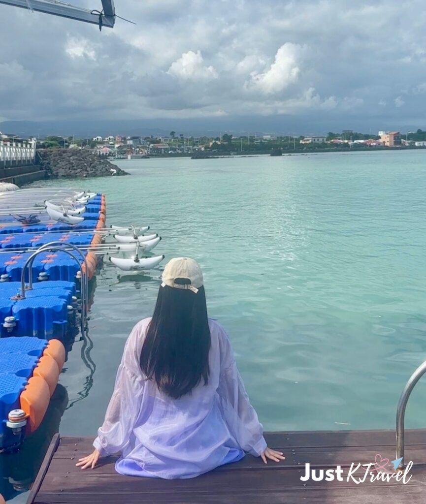 Traveler enjoying crystal clear blue sea view in Jeju Island South Korea