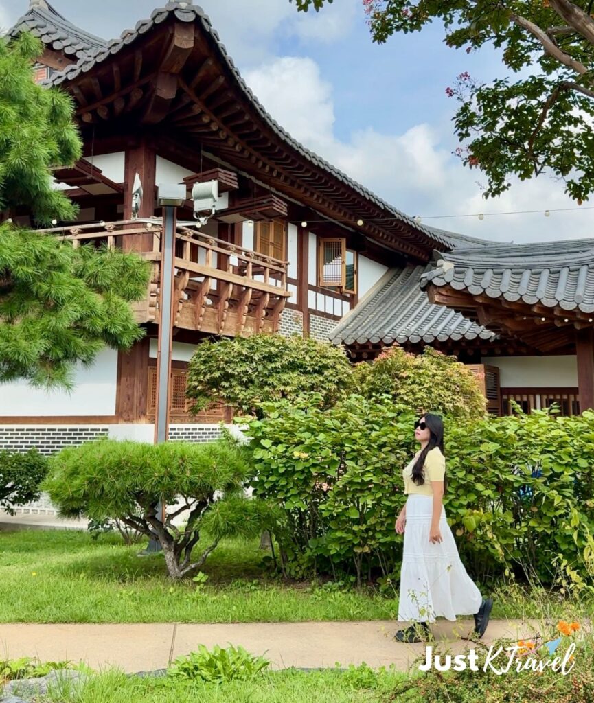 Visitor standing in front of traditional hanok buildings at Suwon Traditional Culture Center in Suwon, South Korea