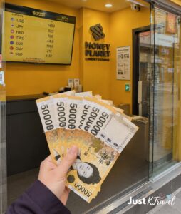 Exchanging Korean Won at a money exchange shop in Myeongdong Seoul South Korea