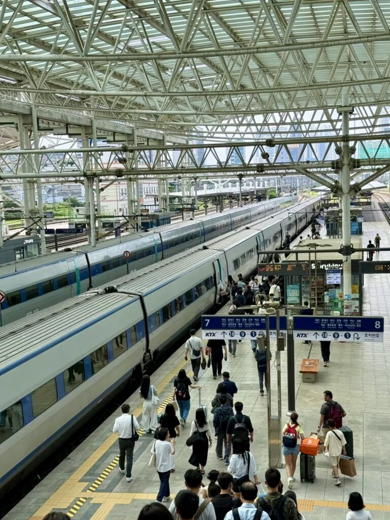 Travelers entering KTX train at Seoul Station during Korea holiday season
