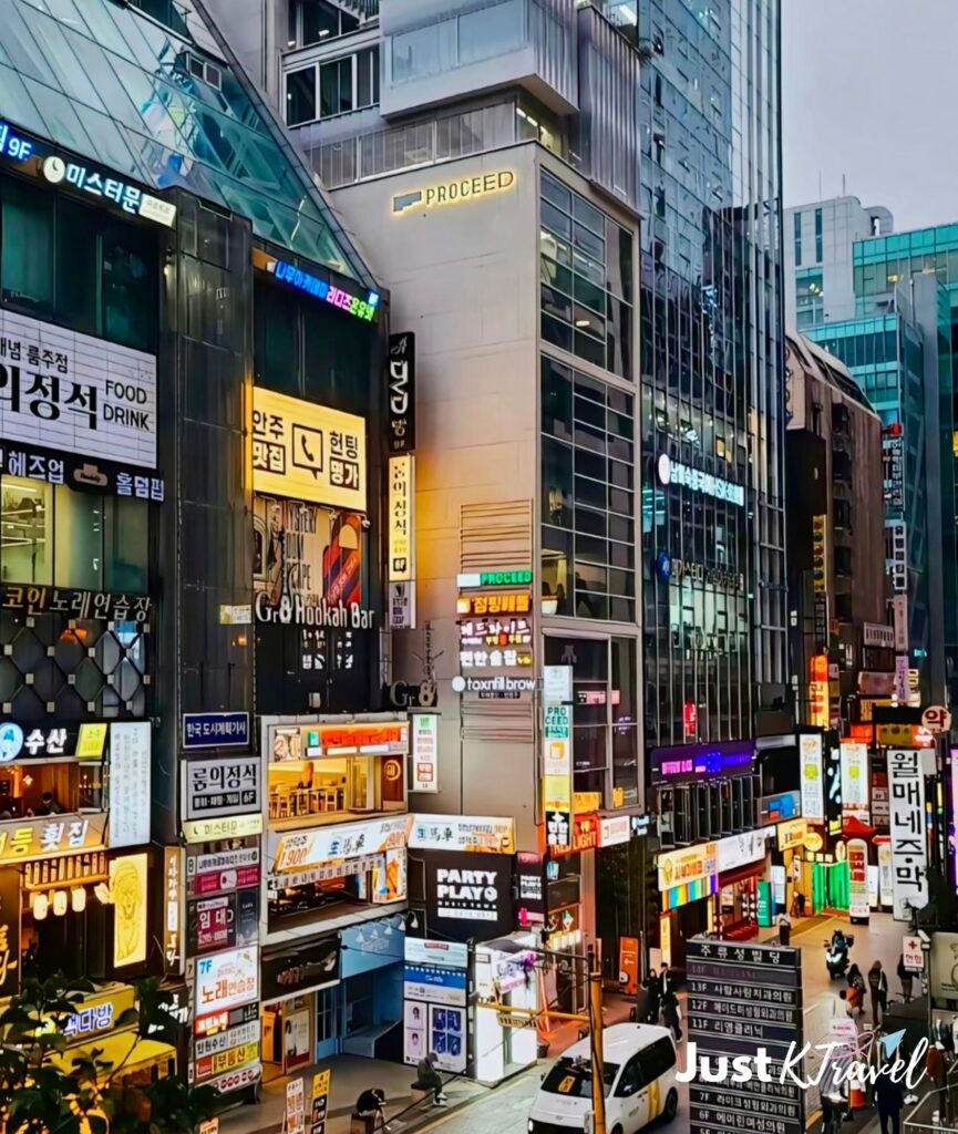 Hongdae shopping street at night with restaurants and crowds in Seoul