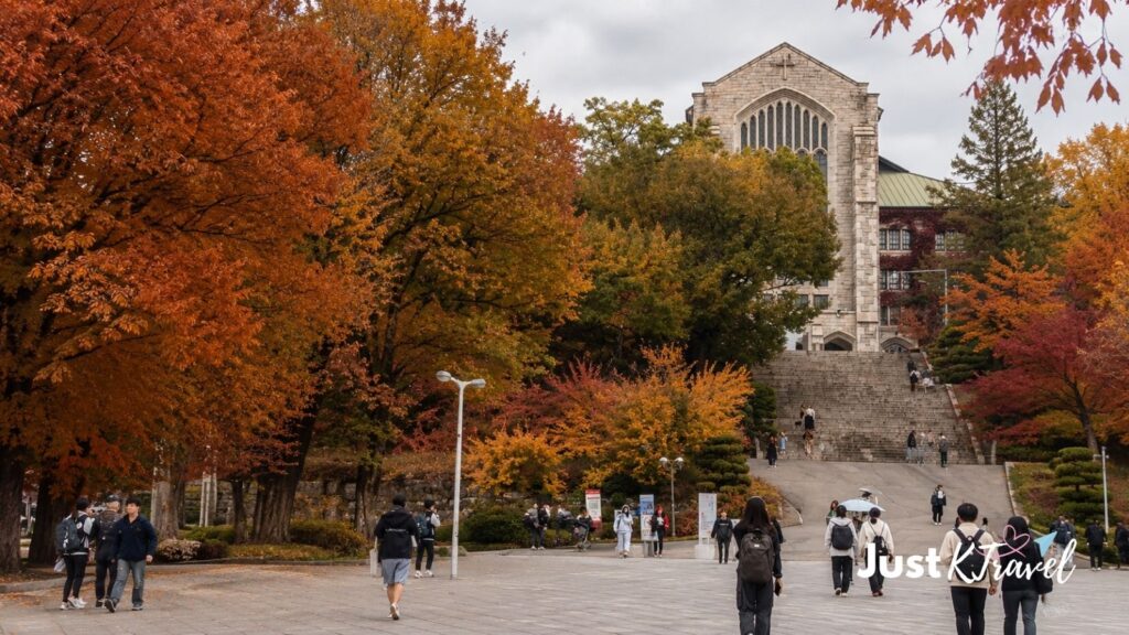 Students walking through Ewha Womans University campus during autumn