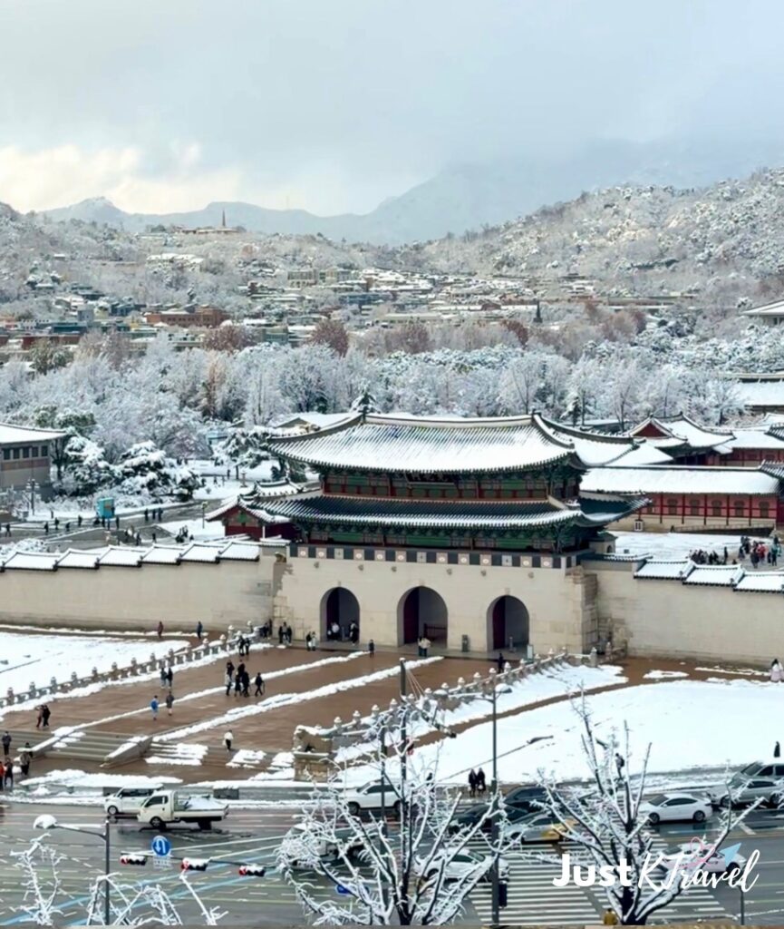 Gwanghwamun Gate and snowy mountain in Seoul during winter