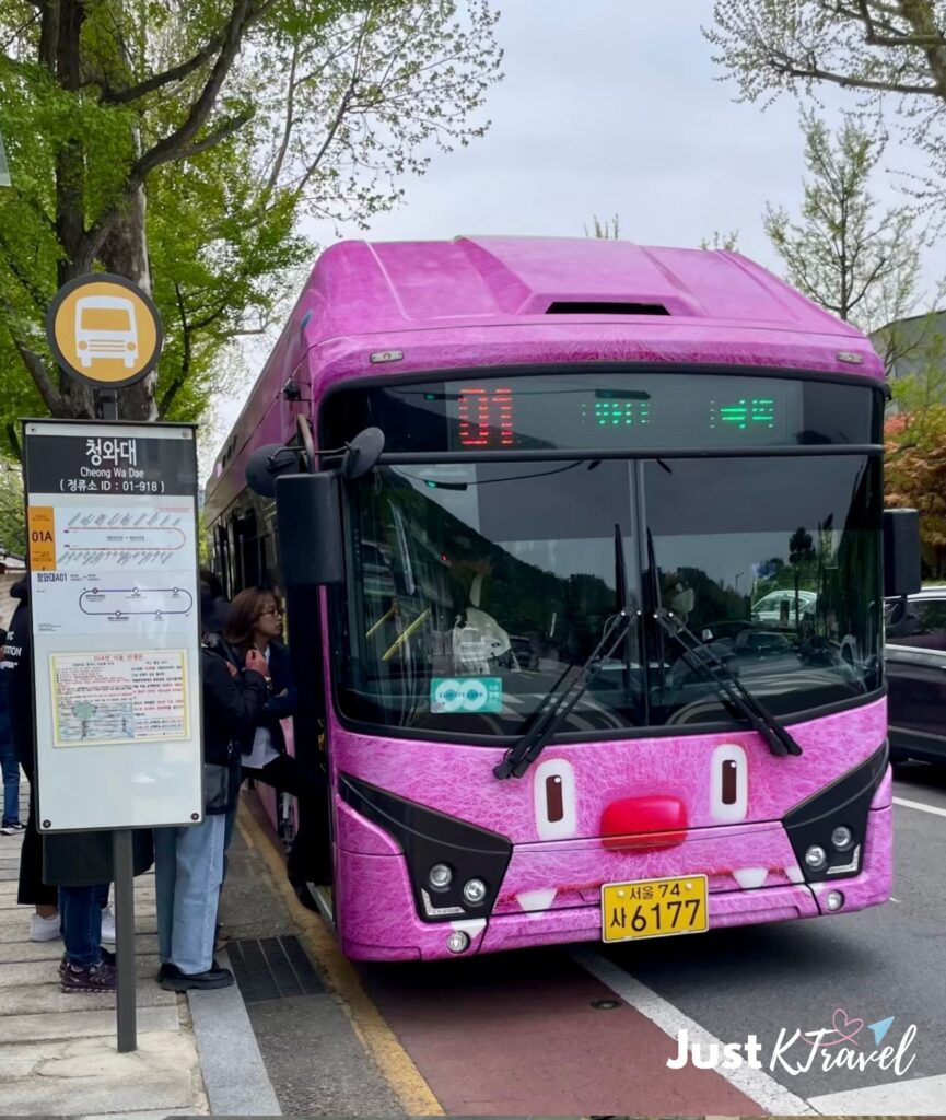 Haechi Seoul city bus traveling through Seoul during autumn