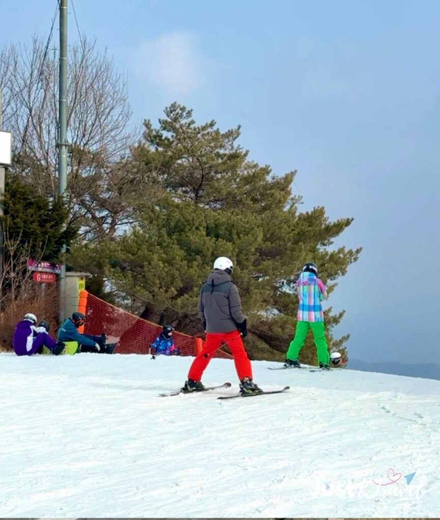People skiing at a snowy ski resort in Korea