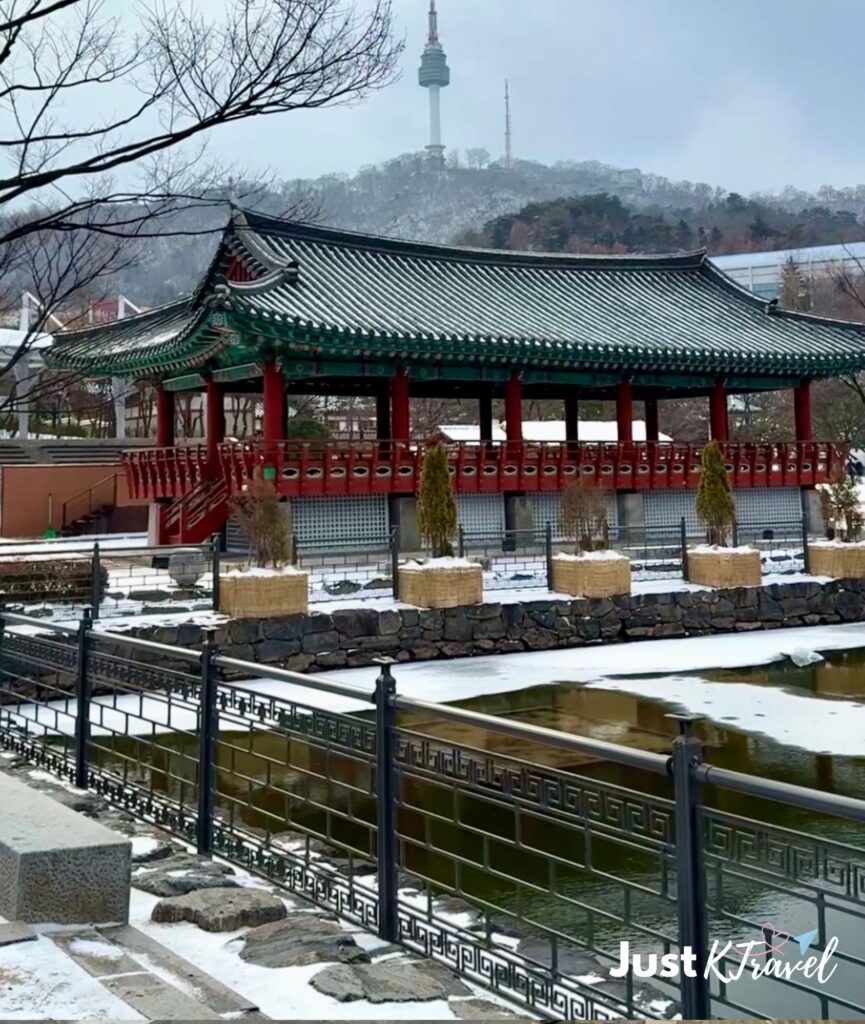 Namgoll Hanok Village pavilion and N Seoul Tower in snowy Seoul