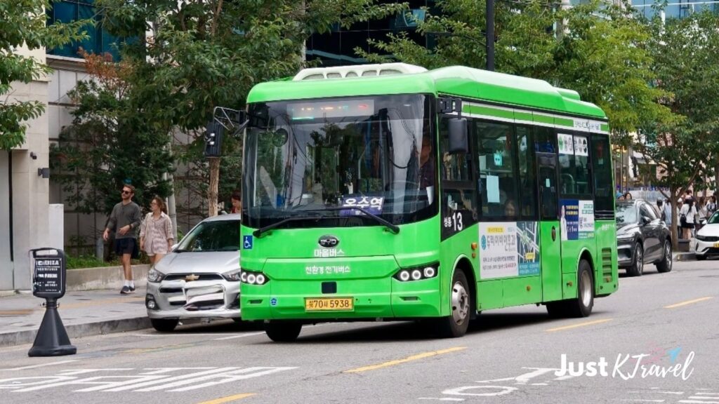 Seoul city bus traveling along a busy street