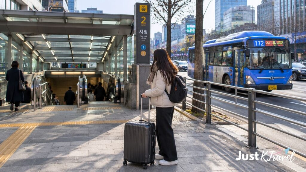 Female traveler with suitcase choosing Seoul subway or bus