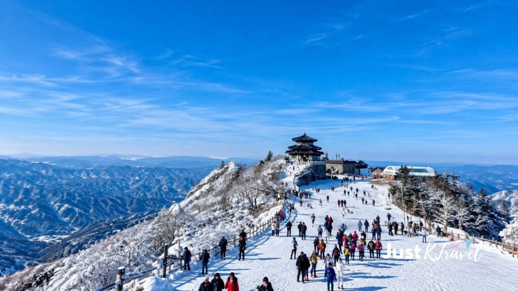 People enjoying the snow-covered mountain scenery at Deogyusan National Park in South Korea during winter
