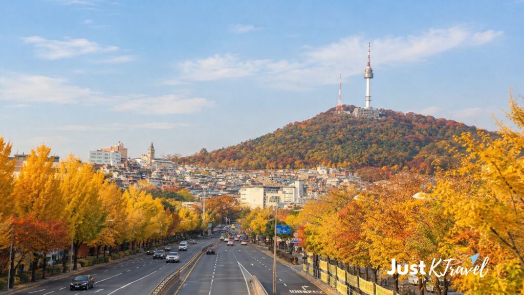 Noksapyeong Bridge with N Seoul Tower, passing cars and autumn foliage in Seoul