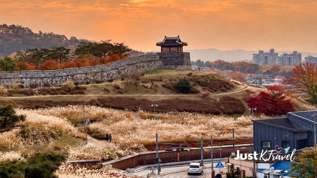 Suwon Hwaseong Fortress with autumn foliage and grass